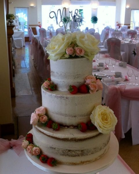 semi naked cake with roses